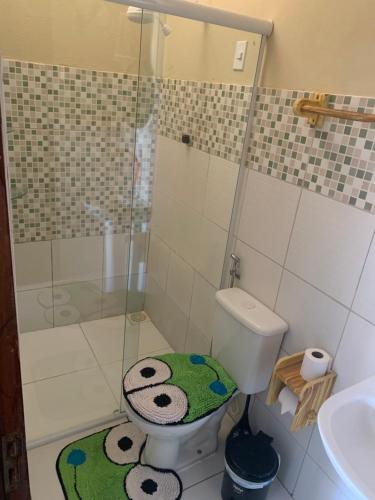a bathroom with a shower and a toilet and a sink at Mirante da Lua Residence in Aracati