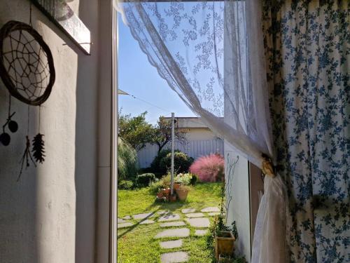 an open window with a view of a yard at Jangheung Stay 1978 in Jangheung