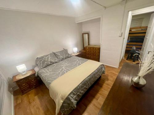 a bedroom with a large bed in a room at Casas Rabad in Punta Arenas