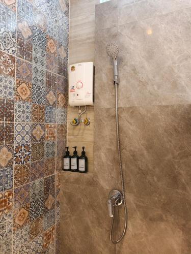 a shower in a bathroom with a shower at Wild Orchid Krabi in Ao Nam Mao