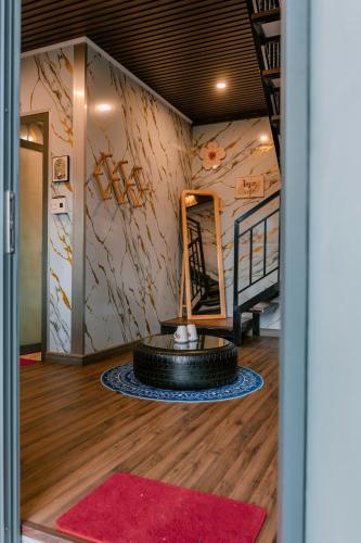 a room with a tire on the floor and a mirror at Angels Homestay & Coffee - Măng Đen in Kon Von Kla