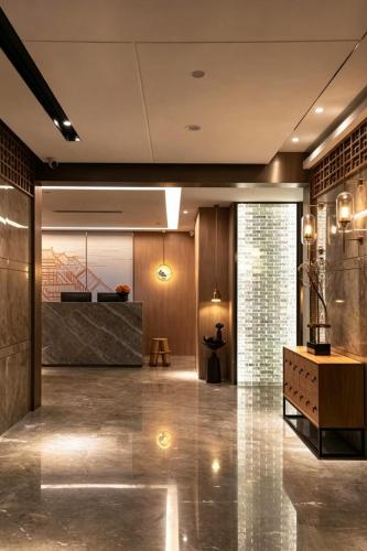 a lobby with a reception desk in a building at Chongqing Qingyue Hotel Direct access to Metro Line 1 & Line 2 right outside the hotel Located in Longhu Shidai Tianjie commercial area Open to international travelers Free laundry & drying facilities Free high-speed WiFi Free local sightseeing advice in Chongqing