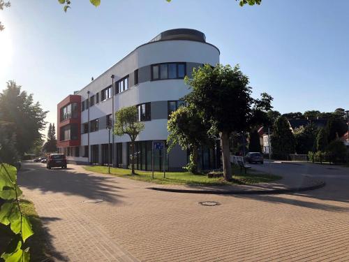 a building on the side of a street at Panorama Suite in Lubmin