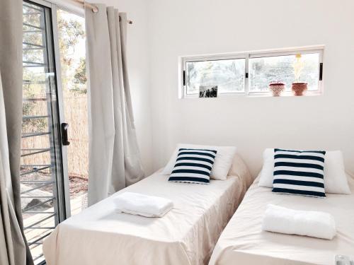 Ένα ή περισσότερα κρεβάτια σε δωμάτιο στο Mahalo Aparts