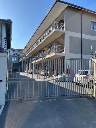 a building with cars parked in front of it at BEREA apartment 786 in Durban