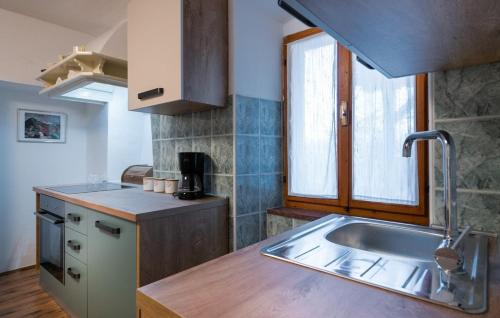 a kitchen with a sink and a counter top at Villa Maria in Krnica