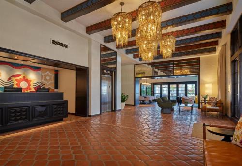 a lobby of a hotel with chandeliers at Mar Monte Hotel, in The Unbound Collection by Hyatt in Santa Barbara