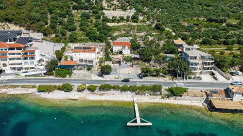 a sail boat in the water next to a city at Villa Matej by Villas Guide in Zaton