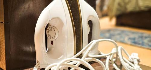 a white toaster sitting on top of a table at The Blessing Villa Vellore in Vellore