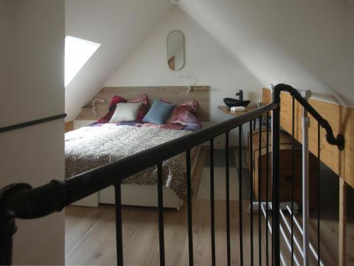 a bedroom with a bed with pillows on it at Studio LEOPOLD LEIBNITZ in Leibnitz