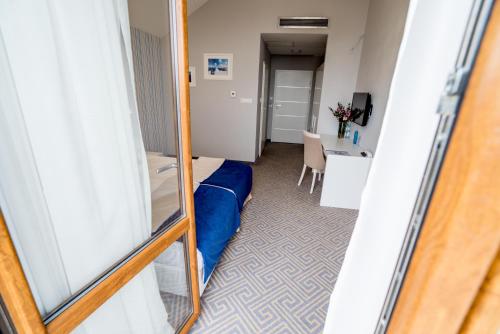 Posteľ alebo postele v izbe v ubytovaní Hotel Aleksandria