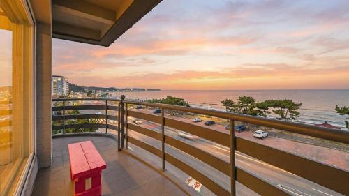 a balcony with a view of the ocean at Baradeon Bada Pension, Yangyang in Yangyang