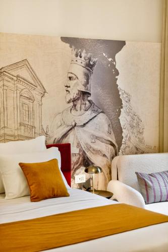 a mural of a king with a crown on a wall at King Richards Royal Residence in Dubrovnik