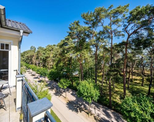 a view from the balcony of a house with trees at Villa Lebensart - App 7 Lebensart in Ahlbeck