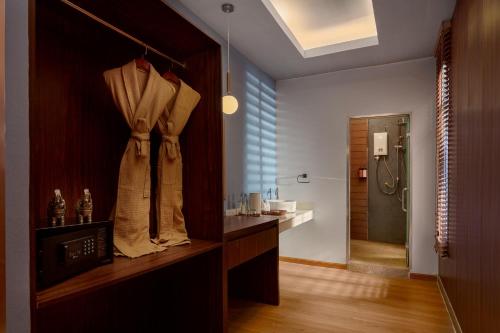 a bathroom with a sink and a shower in a room at One Beach Resort by EHM in Koh Rong Sanloem