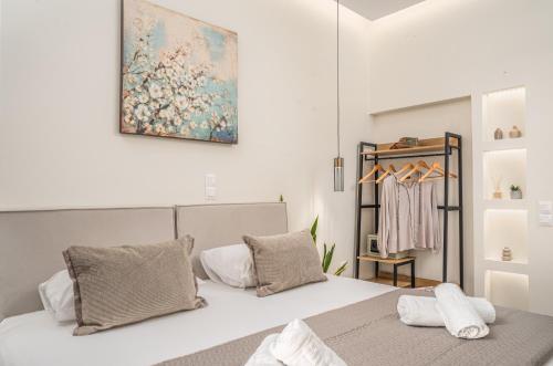 a bedroom with a bed and a painting on the wall at Villa Dionysios in Keri