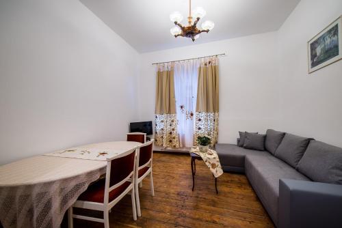 a living room with a couch and a table at Seaside house in Liepāja