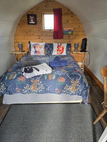 a bedroom with a bed in a small room at Cherry Trees Farm Campsite in Welton