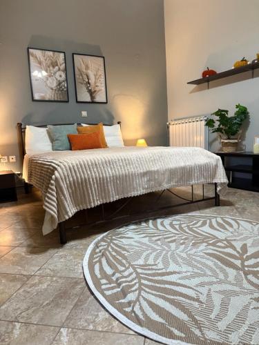 a bedroom with a large bed and a rug at Aliki's house in Líthion