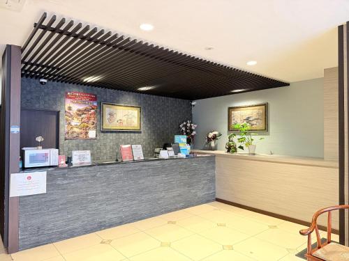 a restaurant with a cashier counter in a room at Hotel Arashi Namba No001 in Osaka