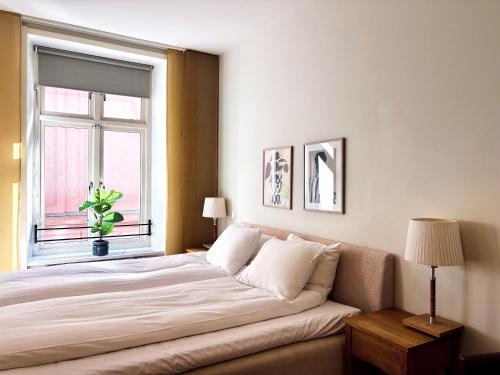 En eller flere senge i et værelse på Hotel Vanilla