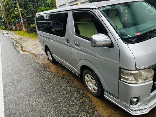 a silver van parked on the side of a street at Kdh TRH 2014 in Wennappuwa