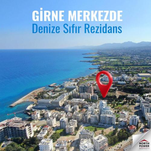 an aerial view of a city with a red marker at North Residence Sea View Cozy Home in Kyrenia