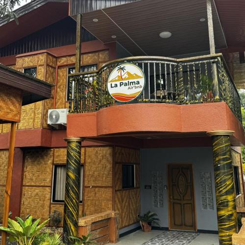 a building with a balcony on top of it at La Palma Air'bnb Malaybalay in Casisang