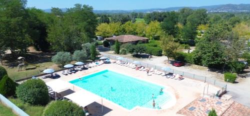 an overhead view of a swimming pool at a resort at ZEcamping 3 dog friendly piscine dans le parc régional du Verdon in Valensole