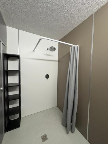 a bathroom with a sink and a shower curtain at Stäy Gronau in Am Berge