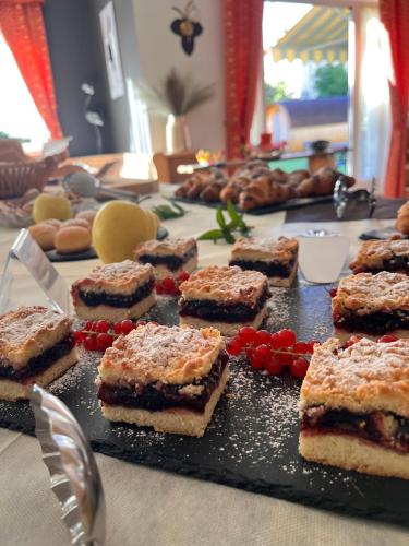 a table full ofasteryasteryasteryasteryasteryasteryasteryasteryasteryasteryasteryastery at Hotel Garni Relax in Fai della Paganella
