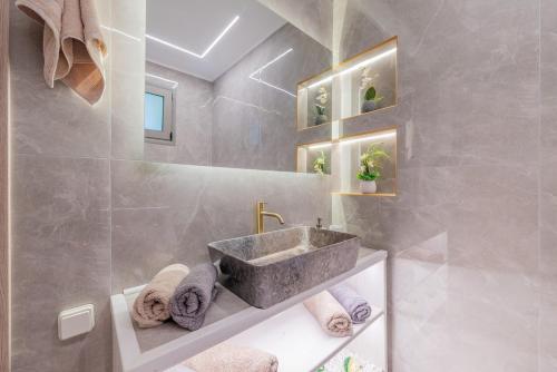 a bathroom with a sink and a shower at Angel House in Ialysos