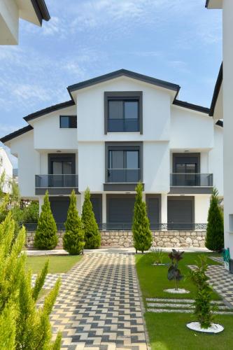 a rendering of a house with a landscaping at Premium Homes in Didim
