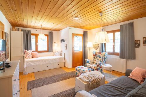 a living room with a couch and a table at Haus Berta, Montafon in Partenen