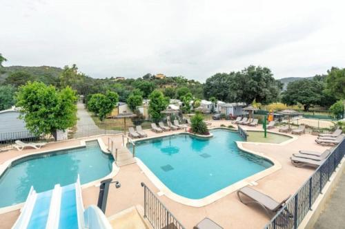 an image of a pool at a resort at ZEcamping 3 étoiles à 4km de la plage piscine chiens acceptés jacuzzi in Bormes-les-Mimosas