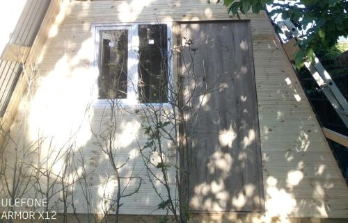 a wooden door on a house at Ada chalet in Mărăcineni
