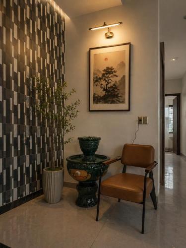 a chair and a table and a vase in a hallway at Minhtan2 villa in Dong Hoi