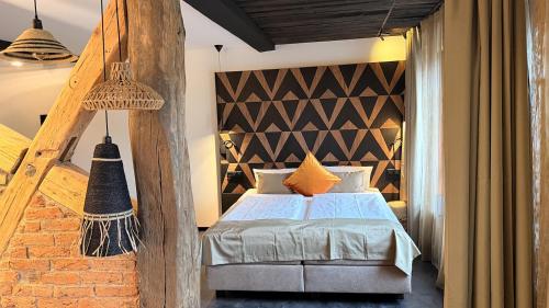 a bedroom with a bed and a wooden wall at Boutique Hotel K7 in Bad Nauheim