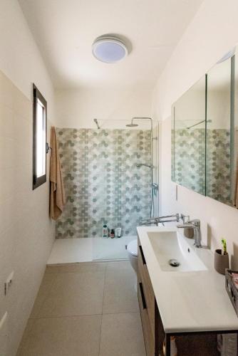 a bathroom with a sink and a shower at Casa Luna in Tricase
