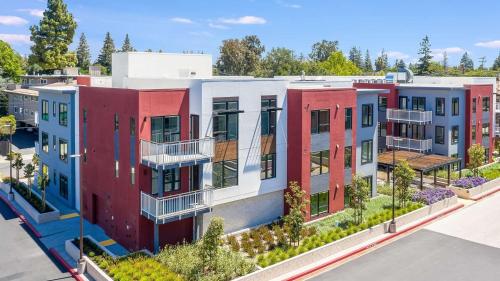 an image of an apartment complex with colorful houses at Realm in Menlo Park
