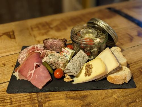 a plate of different types of food on a table at La Calèche Western in Lafarre