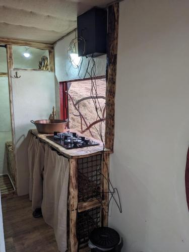 a kitchen with a counter with a bowl on it at La Maison de Hobbit in Lafarre