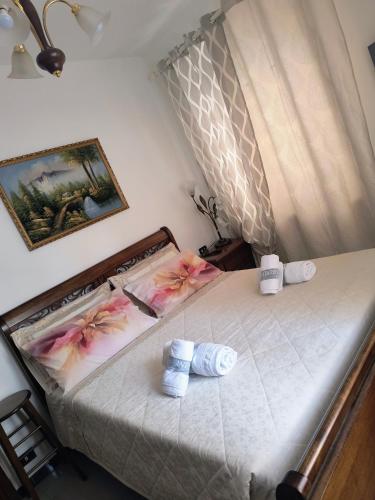 a bedroom with a bed with two towels on it at B&B La Casa di Olga in Bobbio