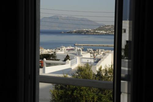 a view of a city from a window at Andriani's Guest House in Mýkonos City
