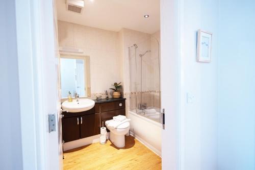 a bathroom with a sink and a toilet and a shower at Harbourside View Whitby in Whitby
