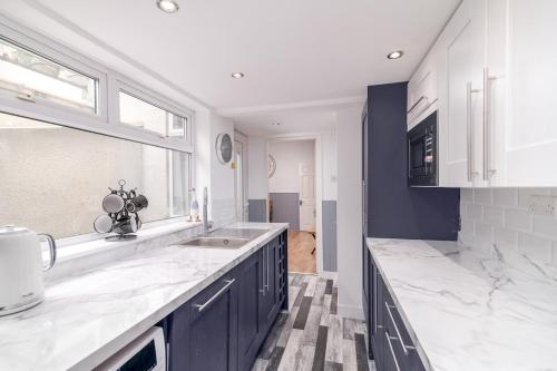 a kitchen with a sink and a counter top at Hope Street in Filey