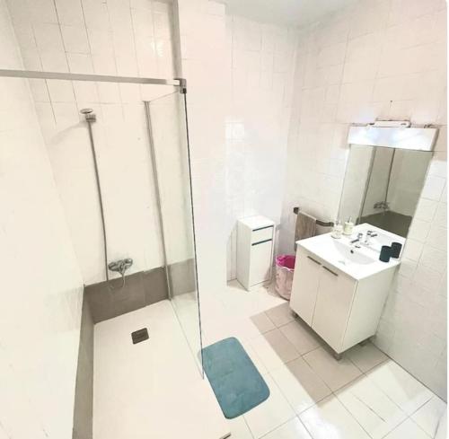 a bathroom with a shower and a sink and a toilet at Barbate Beach Apartment in Barbate