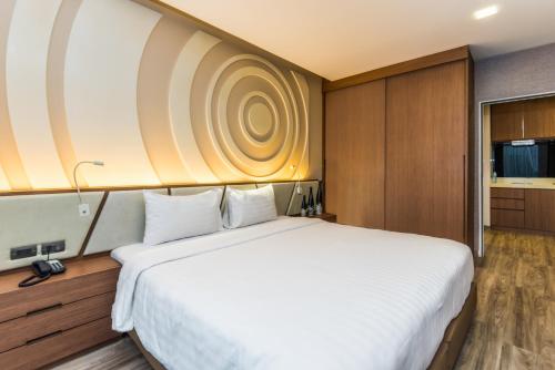 Postel nebo postele na pokoji v ubytování Olive Hotel Bangkok 64