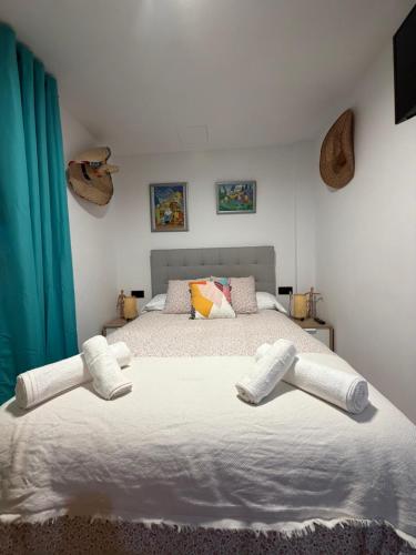 a bedroom with a large bed with two white pillows at Ónice de Riviera 2 in Mijas Costa
