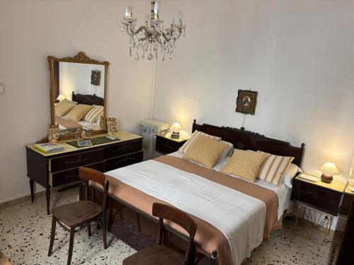 a bedroom with a bed and a dresser and a mirror at Mare Nostrum TF in Tre Fontane